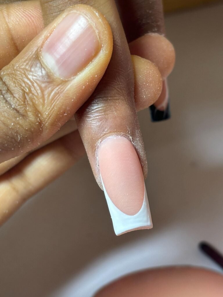 Russian manicure Toronto — clean cuticle line and smile-line French at Evoire Beauty